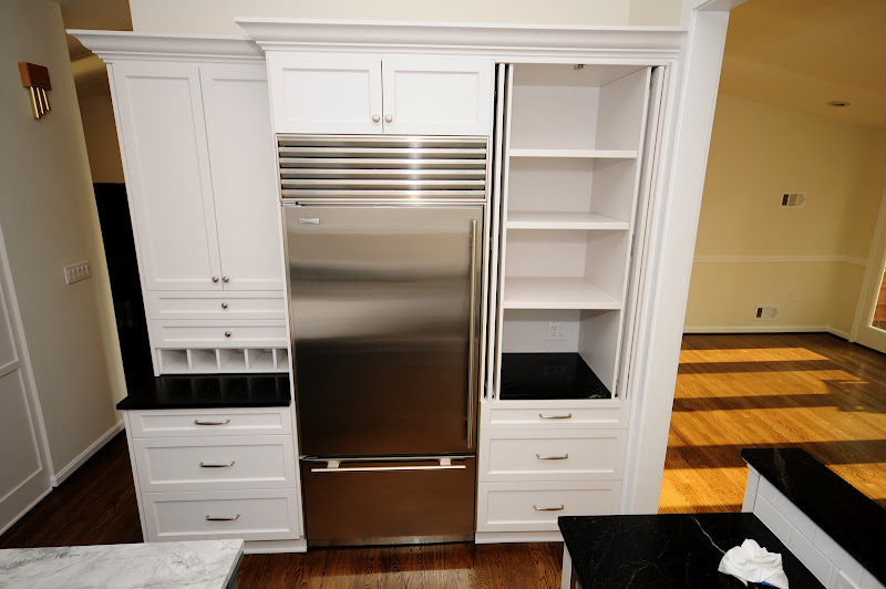 Retractable pantry door cabinet. Perfect spot for the small appliances title=