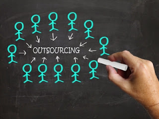 Should your credit union outsource its statements? outsource-figures-on-blackboard