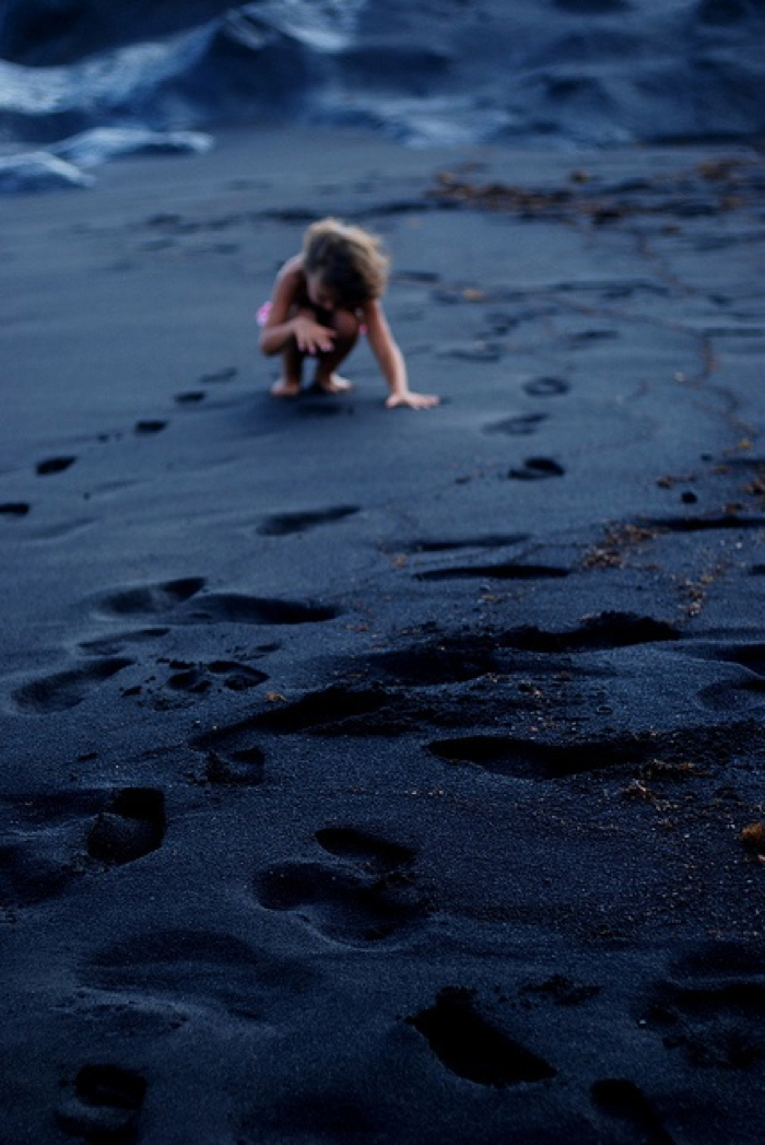 child plying on the beach