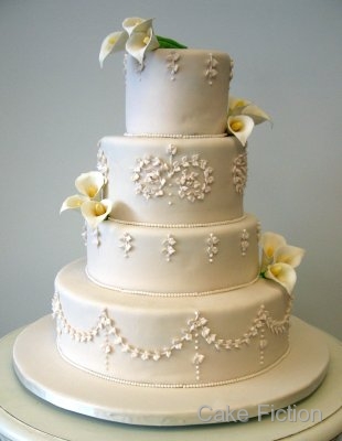 I was so excited to make this four tier ivory fondant wedding cake decorated