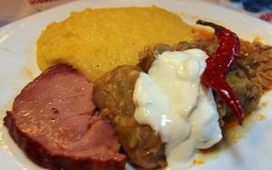 Sarmale with polenta, cream, smoked meat and chilly pepper