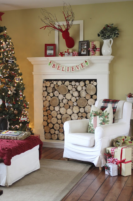 faux fireplace with stacked wood birch logs at Christmas- www.goldenboysandme.com