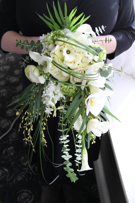  are all combined to create this beautiful cascading wedding bouquet