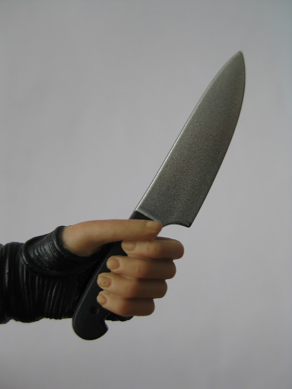 look over the shoulder pose holding knives look over the shoulder pose holding knives