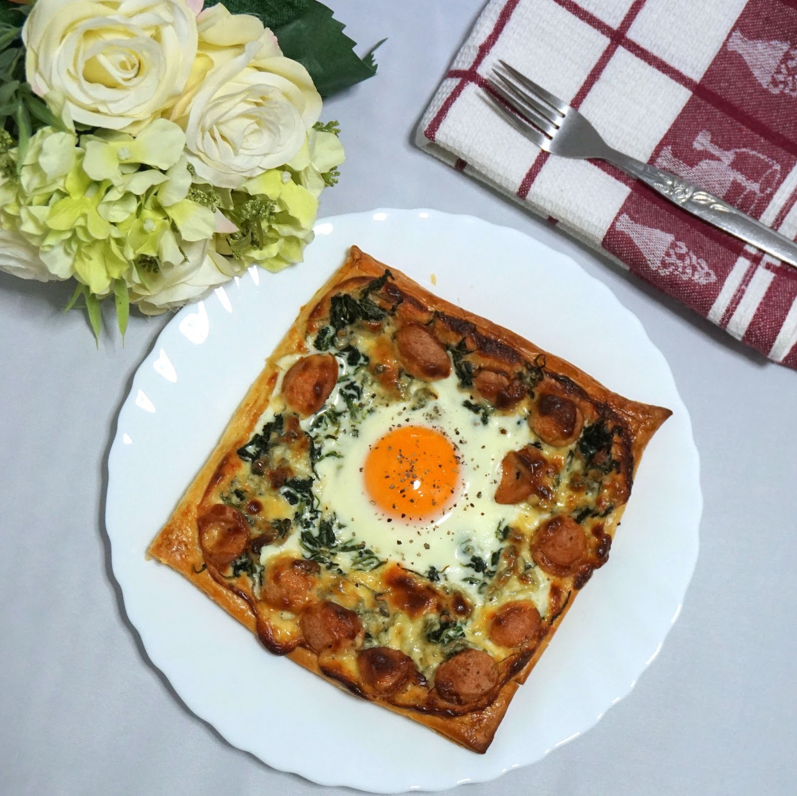 Truffle Spinach Sausage Galette with a runny egg in the middle Sherbakes