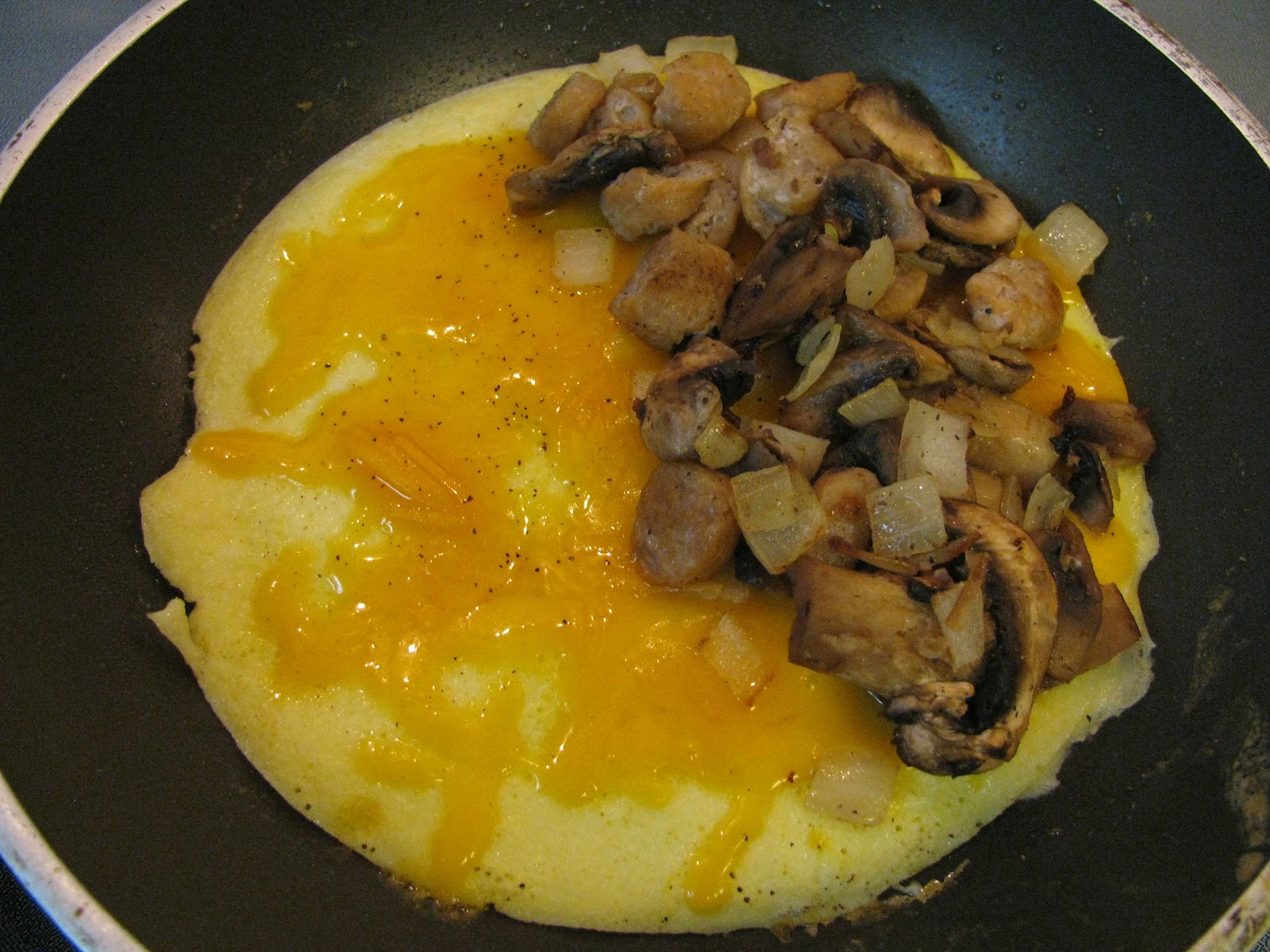 THE SPUNKY COOKIE CHEESE, MUSHROOM, SAUSAGE, & ONION OMELETTE