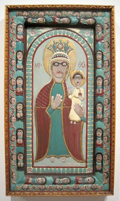 Carved madonna and child, painted, in an iconic style