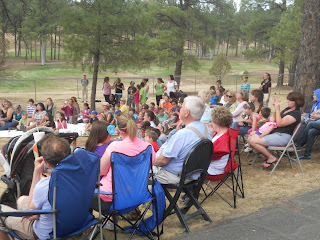 audience at summer reading event visitors in lawn chairs