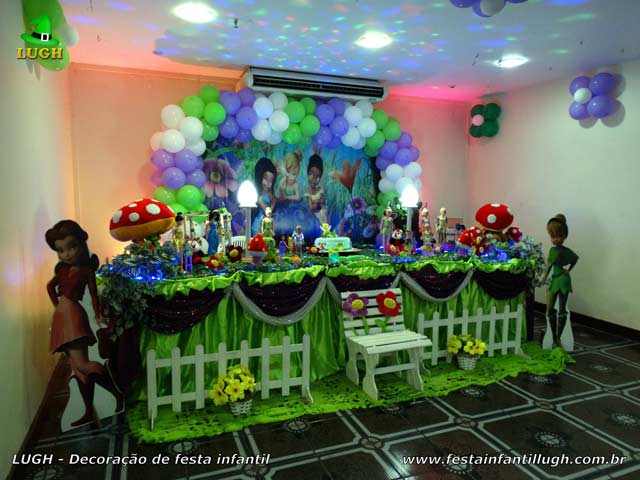 Decoração de festa infantil Tinker Bell Decoração de festa infantil Tinker Bell em mesa com toalhas de tecido para aniversário feminino, realizado na Barra da Tijuca - Rio de Janeiro (RJ)