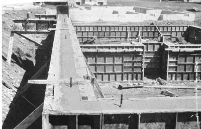 These concrete foundation walls for an apartment building, with their steel formwork not yet stripped, rest on wall footings. For more extensive illustrations of wall and column footings These concrete foundation walls for an apartment building, with their steel formwork not yet stripped, rest on wall footings. For more extensive illustrations of wall and column footings