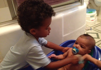 Noah Helping with Elijah's Bath