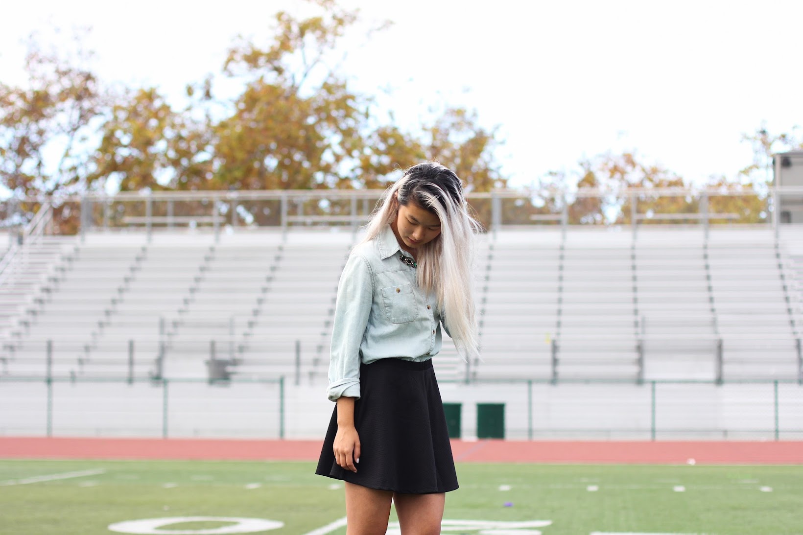 Try different compositions - the full outfit doesn't have to be included every time. A fall outfit composed in front of some bleachers.