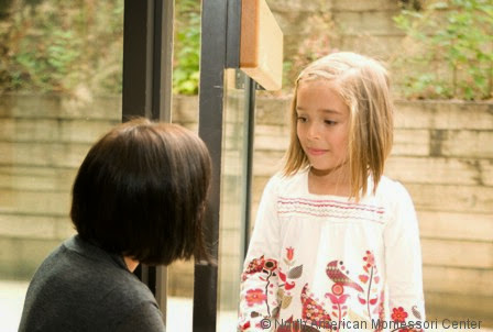 NAMC montessori three levels of obedience teacher greeting girl