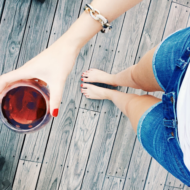wine and shorts on the deck