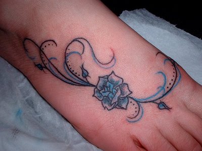 Flower Tattoo With Vines. lilly flower tattoos. lower
