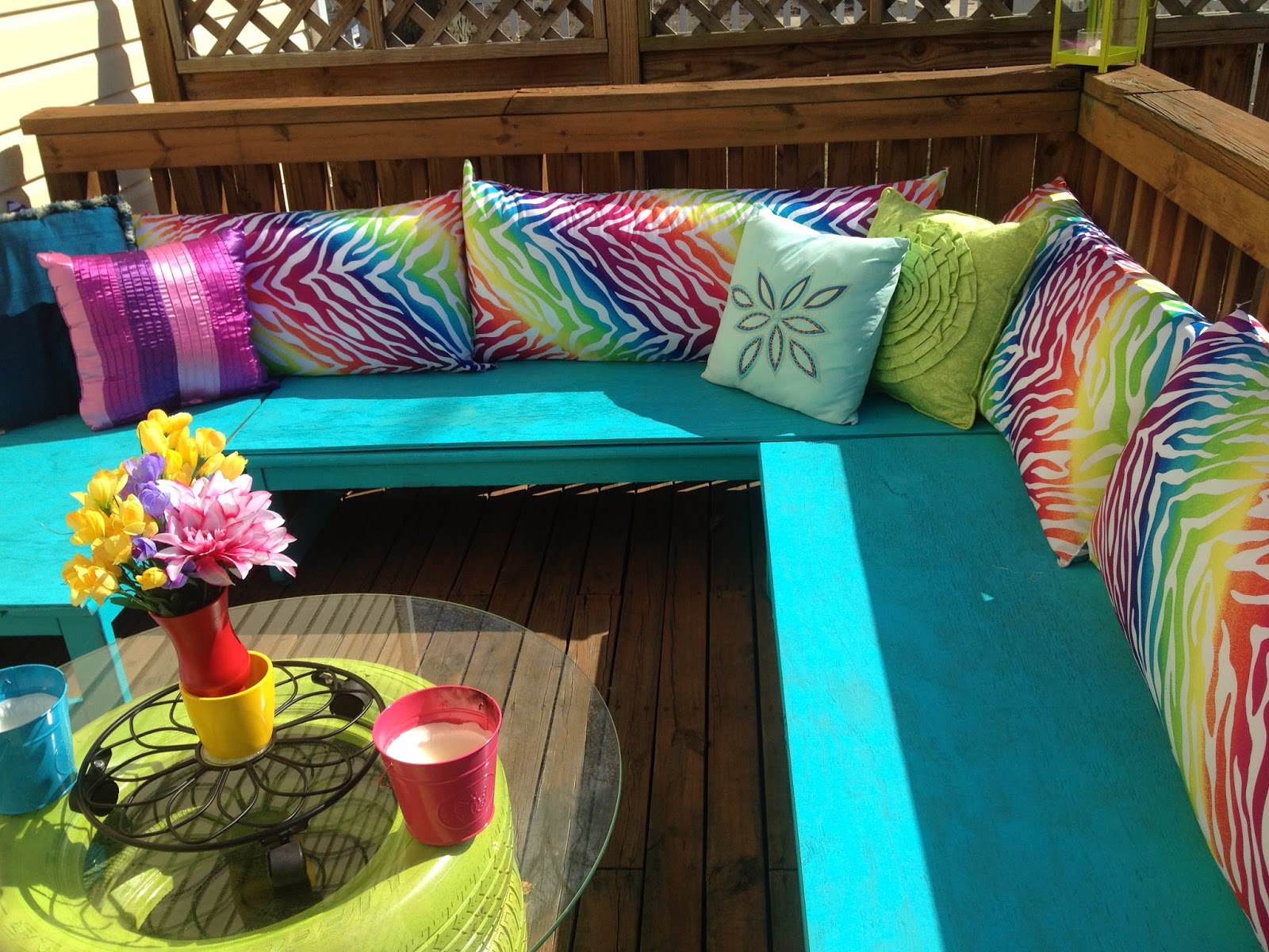 Colorful DIY outdoor deck seating benches makeover with tire table