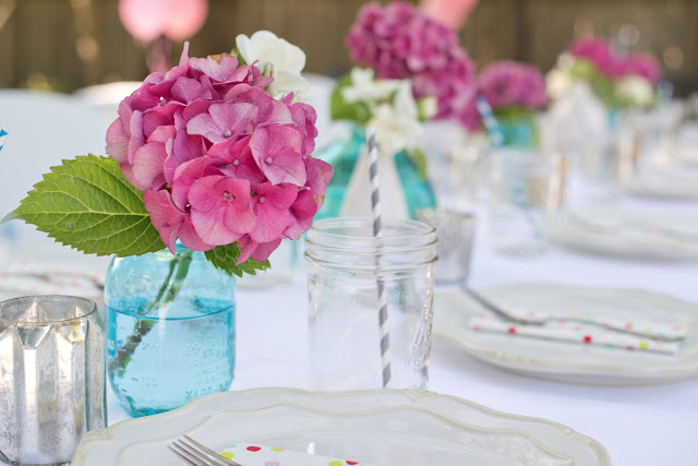 pink hydrangeas and blue canning jars