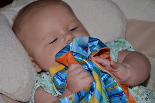 Cute baby Bright Starts Cuddle & Soothe Blanket.