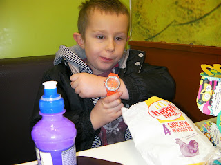 boy with orange wristwatch