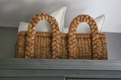 pottery barn basket with white ikea pillows pottery barn seagrass basket with white pillows