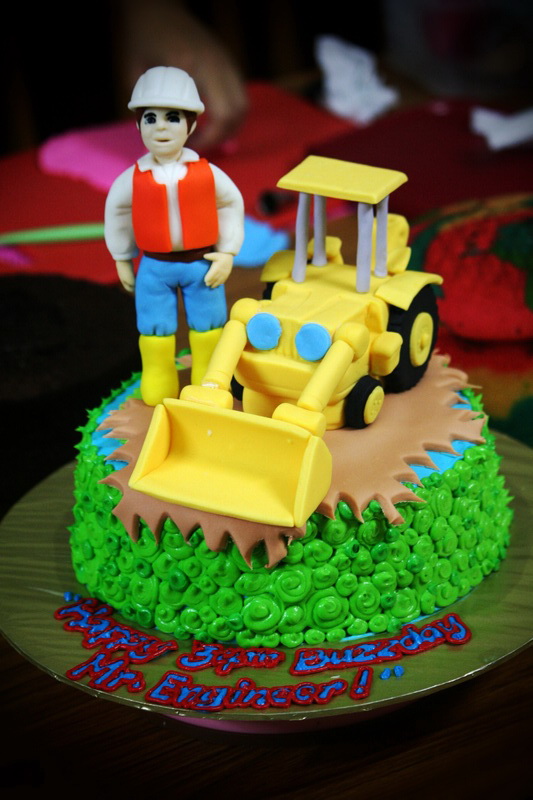 Birthday Cake Center An engineer and a backhoe