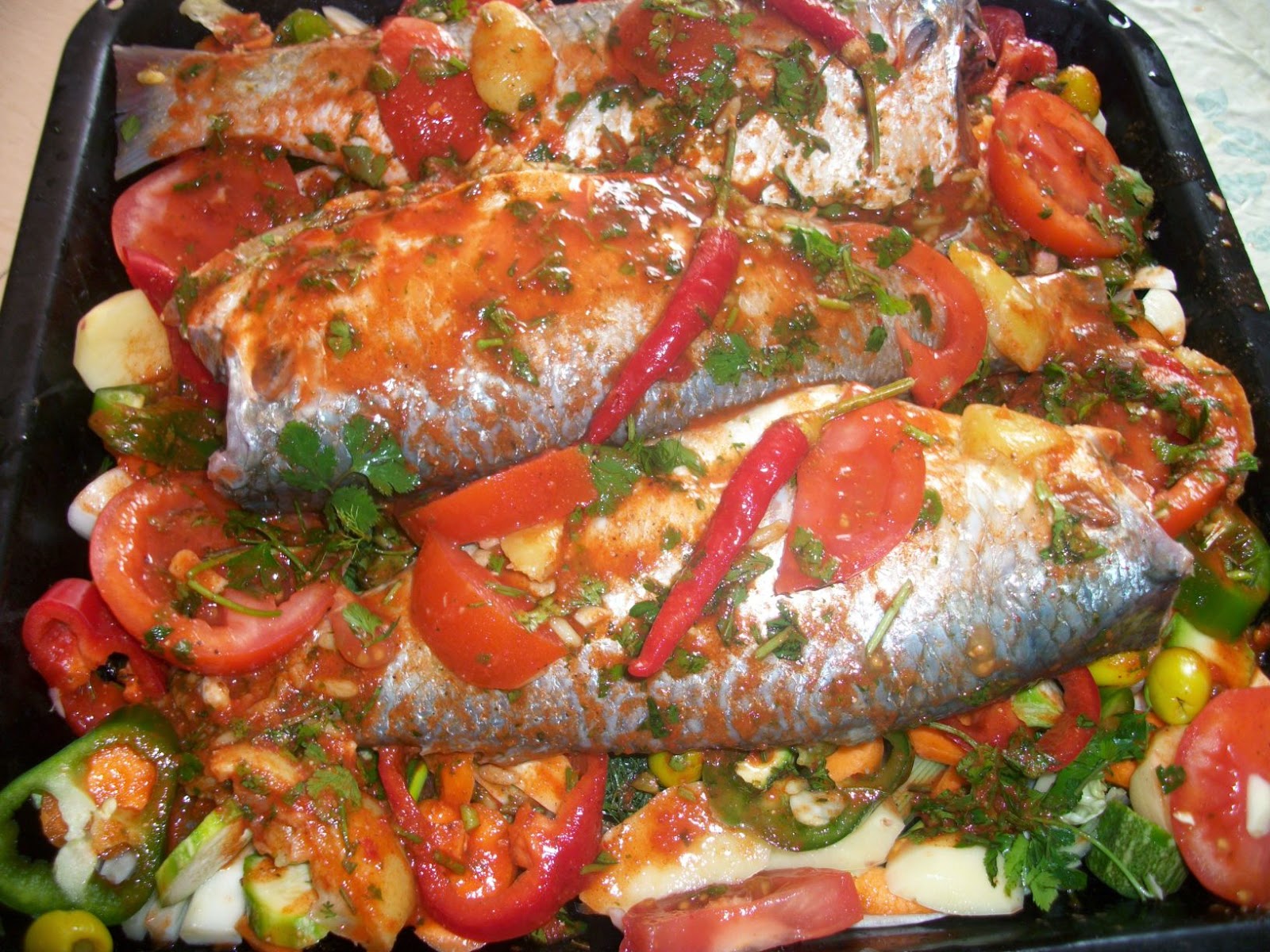 Moroccan baked stuffed fish with vegetables Fleur d'oranger, Masala