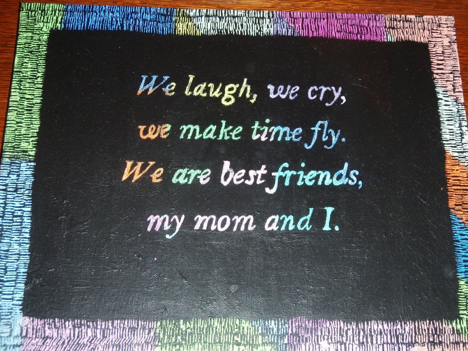 Logan's art portfolio scratch art with oil crayon and black tempera paint