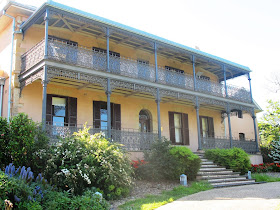 Typical two-storied traditional Australian house with iron balconies.