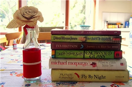 Pile of books: A Dog So Small, Archer's Goon, Journey to the River Sea, Enchanted Glass, Alone on a Wide Wide Sea, Fly By Night