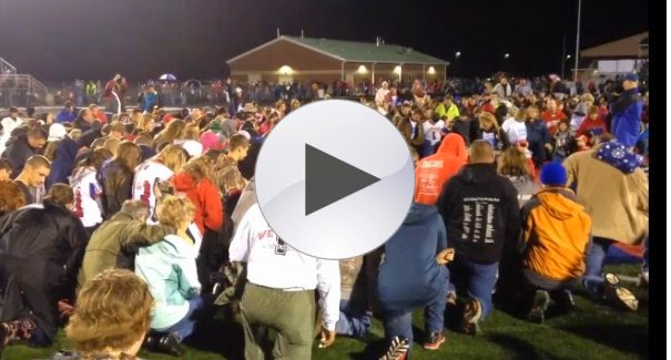http://www.theblaze.com/stories/2014/10/13/what-led-hundreds-of-kids-parents-and-residents-to-bow-down-and-pray-on-a-high-school-football-field-friday-night/