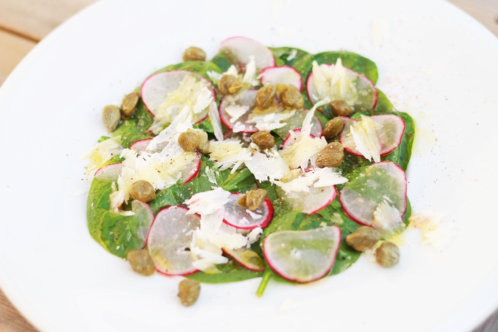 Delicious Tapas Spinach salad with capers, Parmesan cheese and