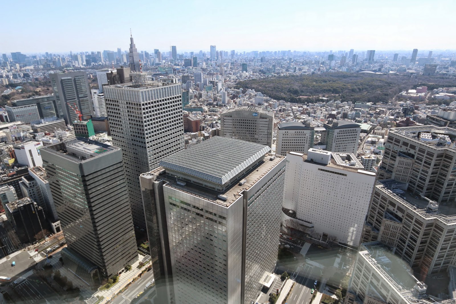 Shinjuku skyscrapers at the business district from the observation deck of Tokyo Metropolitan Government Building in Tokyo, Japan Shinjuku skyscrapers at the business district from the observation deck of Tokyo Metropolitan Government Building in Tokyo, Japan
