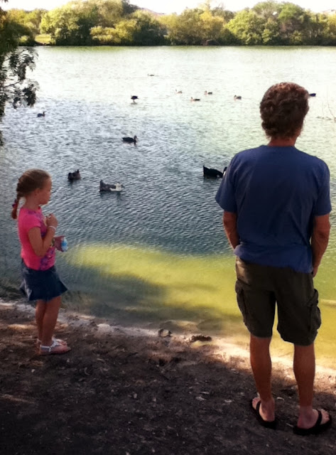 Wordless Wednesday - dad and daughter feeding the ducks image