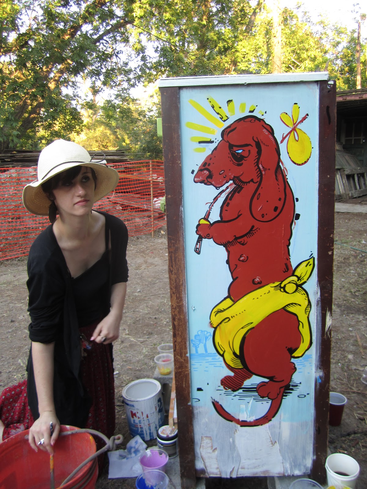 Jose Ray Painting Dog Houses