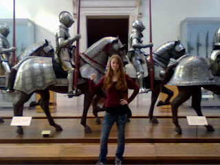 Posing in front of a museum display.