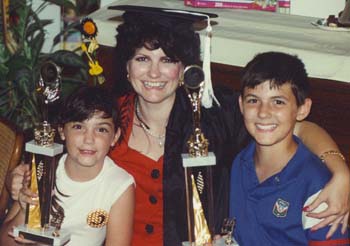 Barbara Truman giving her children trophies for their support