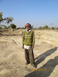 Karsanbhai.Tejabhai, the   worker who feeds the cattle in the "Cattle Sanctuary".