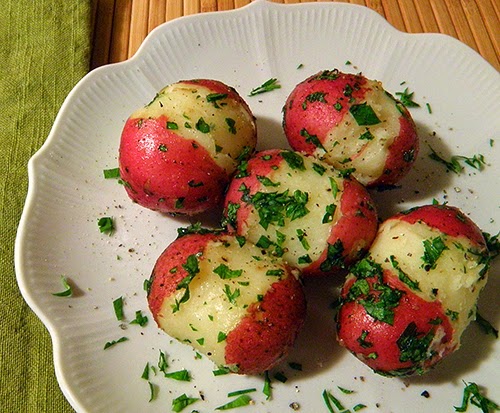 5 Potatoes on Plate Topped with Parsley