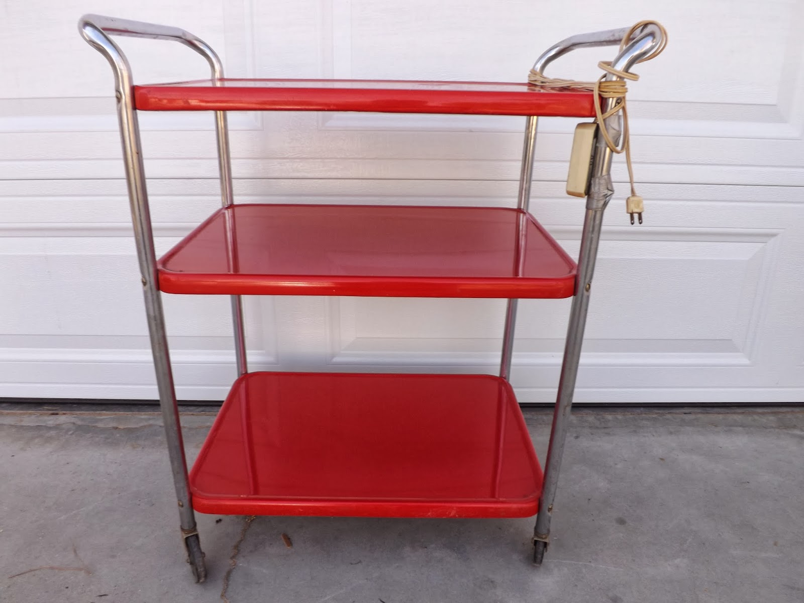 selling excess Vintage red Cosco kitchen cart