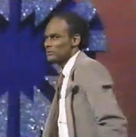 Raymond Taylor strikes a characteristic pose on Wheel of Fortune