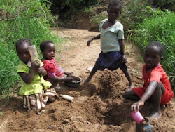 Children getting water from a dry river