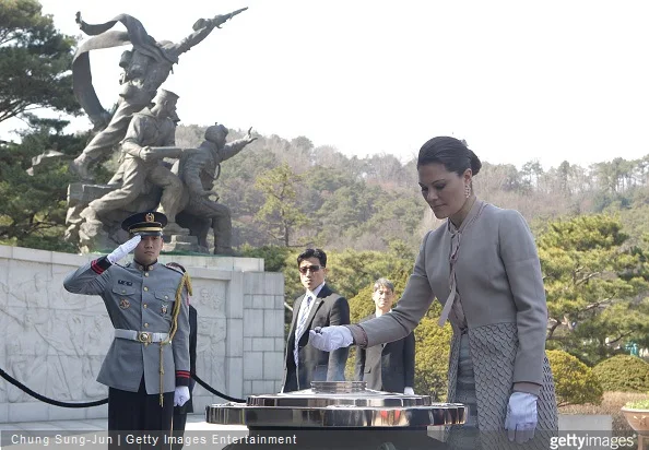 Crown Princess Victoria of Sweden burns incense at Seoul National Cemetery during her visit to South Korea