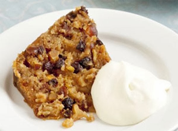Microwave Christmas Pudding:  A light fruited Christmas pudding that's been adapted to be cooked in a microwave on the day of serving. Show as a wedge with cream.