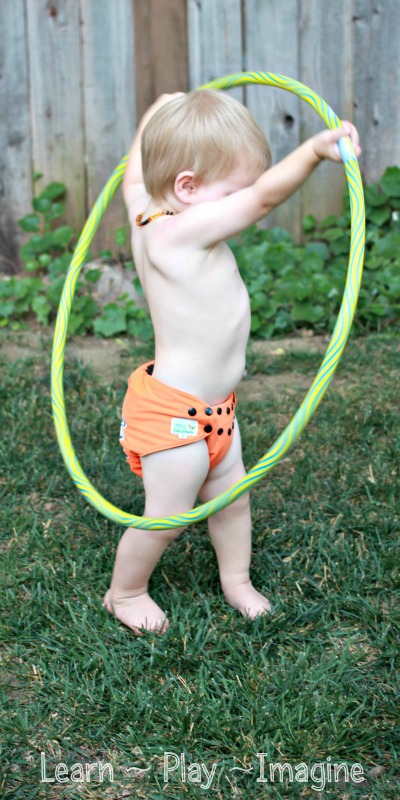 Gross motor activities with a hula hoop that even a toddler can do!