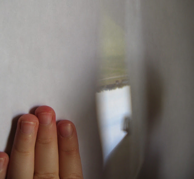 Almost Unschoolers Upside Down Images Through a Magnifying Glass