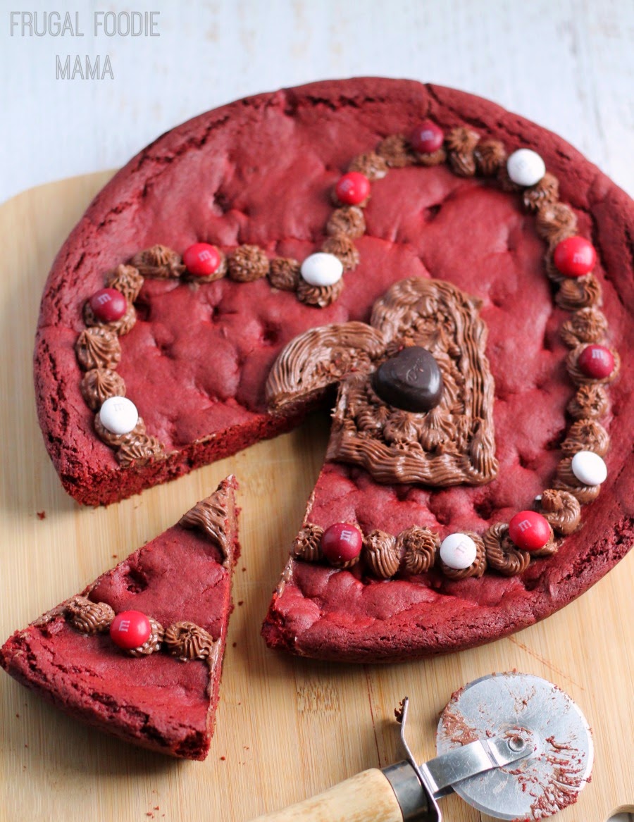 This M&M's® Red Velvet Skillet Cookie is studded with M&M's® Red Velvet candies and then topped with a decadent dark chocolate cream cheese frosting made using Dark Chocolate DOVE® Promises #RedVelvetLove #ad