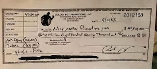 Photo: USD 40.870 Million Dollar Pay-Check issued to Mayweather
