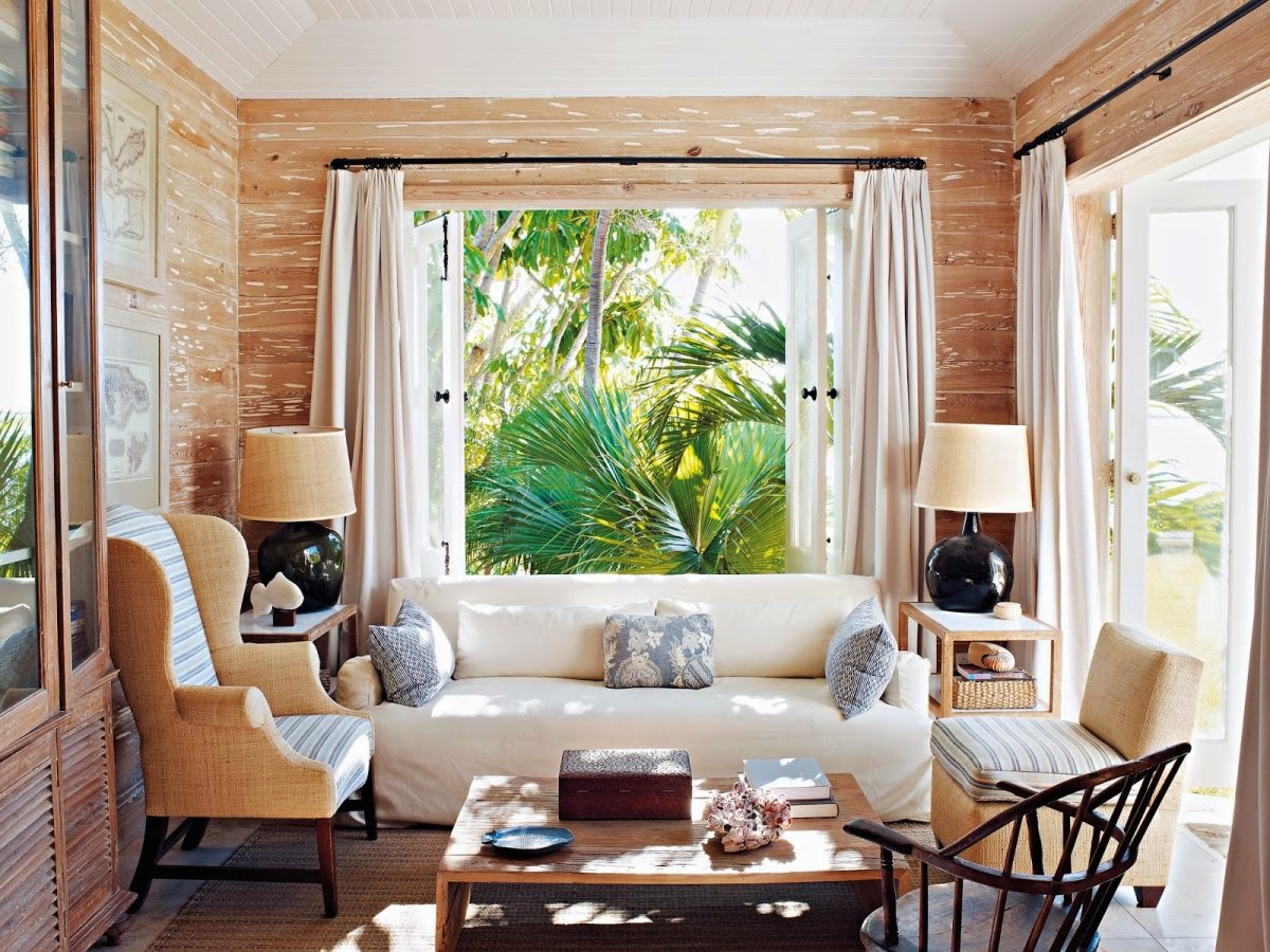 Small tropical house interior sunroom designs with wooden wall and twin table lamp ideas