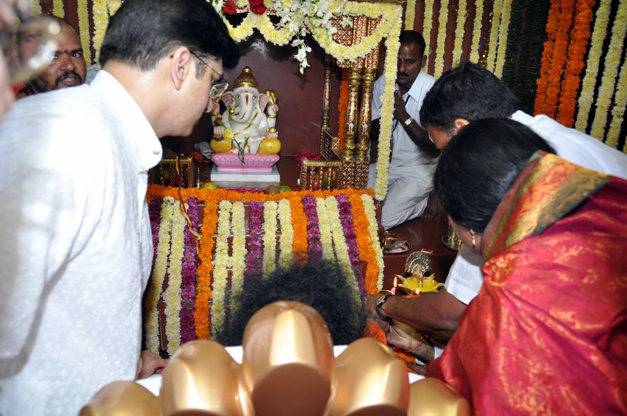 Swami lights the lamps and then, the eternal 'string-puller' pulls the string to do the life-instilling ceremony