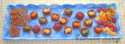 Rainbow Goldfish on pretzels with chocolate scene